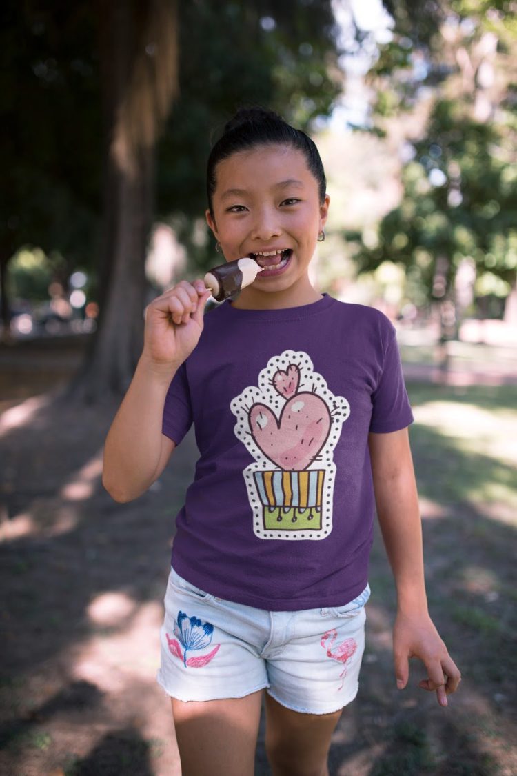 girl wearing heart-cactus-purple tshirt