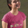 smiling girl in Be Wild Be Brave dark pink tshirt
