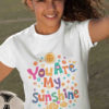 girl holding football wearing You are my Sunshine White tshirt