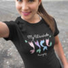 pretty girl in black tshirt with Mermaid tails on clothesline
