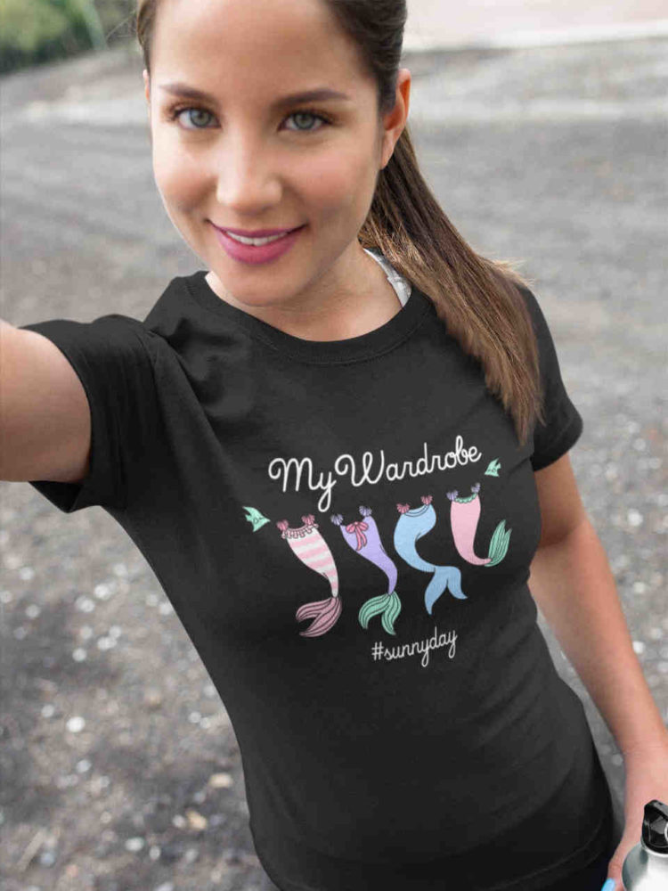 pretty girl in black tshirt with Mermaid tails on clothesline