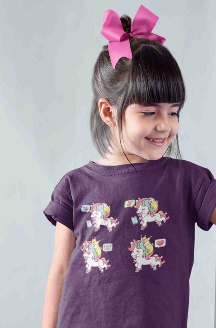 cute girl in purple tshirt with Unicorns with curly rainbow hair