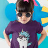 cool girl in purple tshirt with unicorn wearing sunglasses