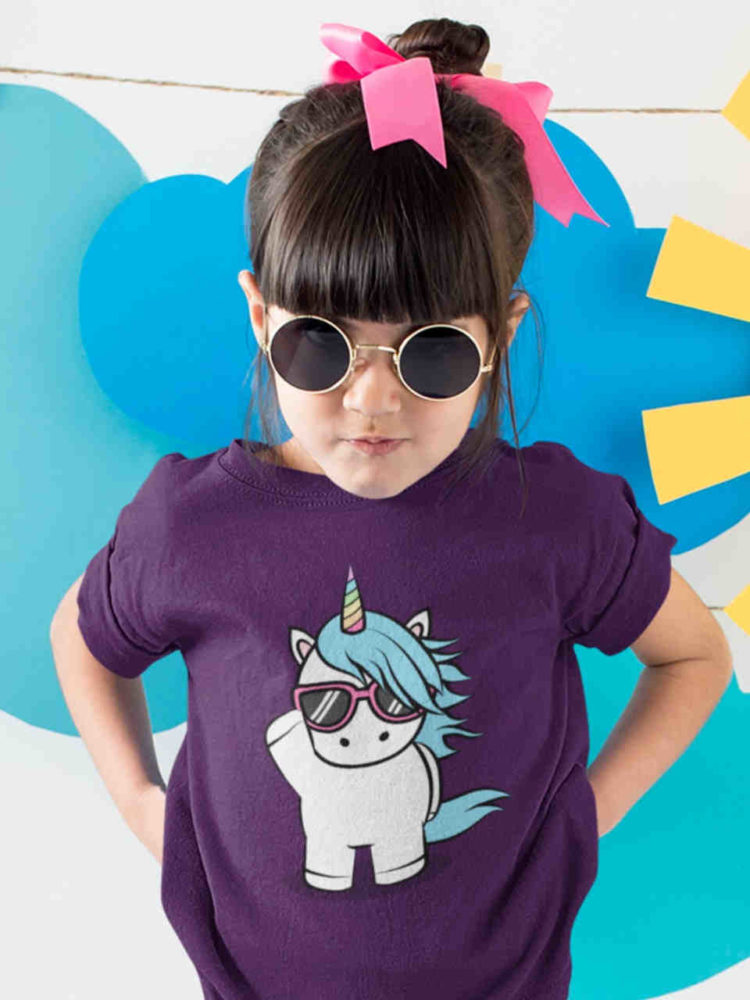 cool girl in purple tshirt with unicorn wearing sunglasses