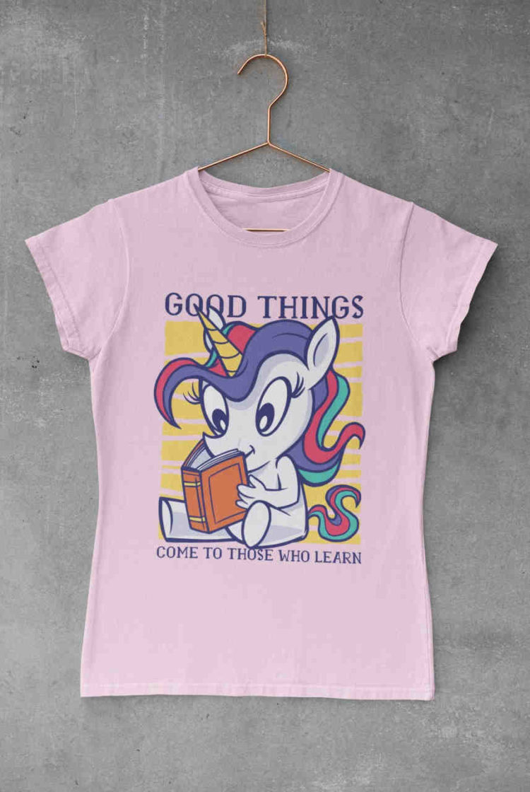 light pink tshirt with Unicorn reading a book