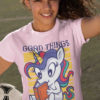 sporty girl in light pijnk tshirt with Unicorn reading a book