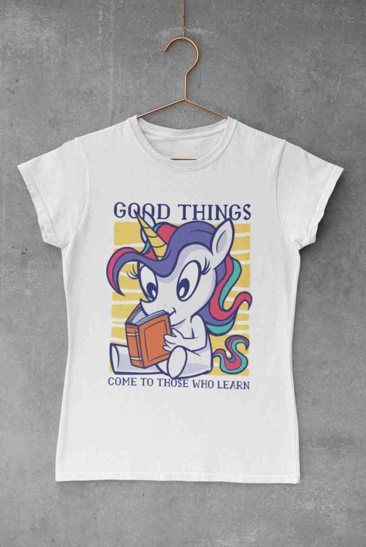 white tshirt with Unicorn reading a book