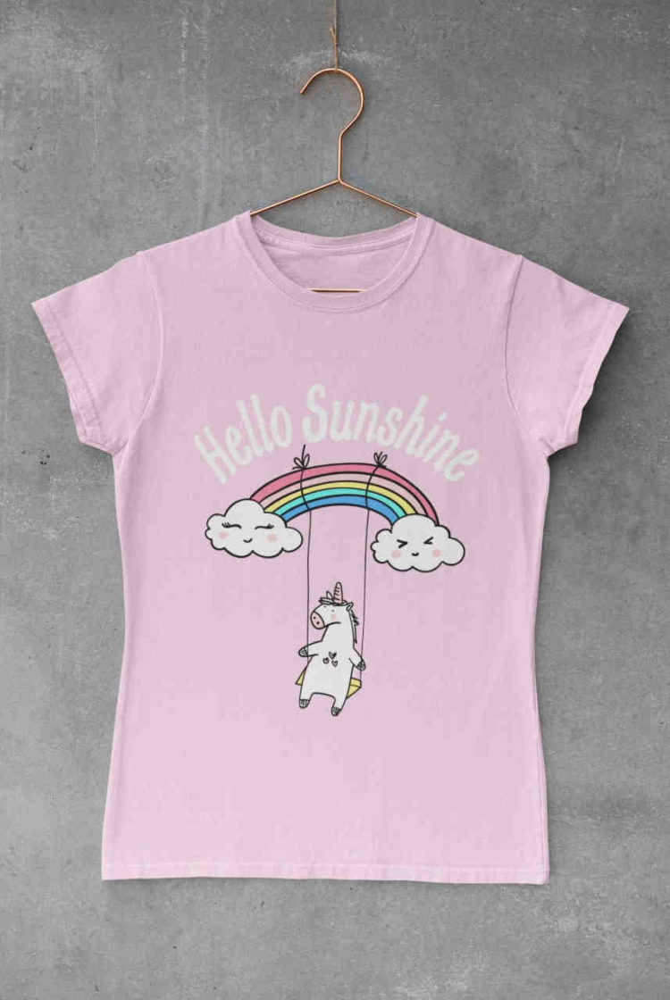 light pink tshirt with unicorn swinging on a rainbow