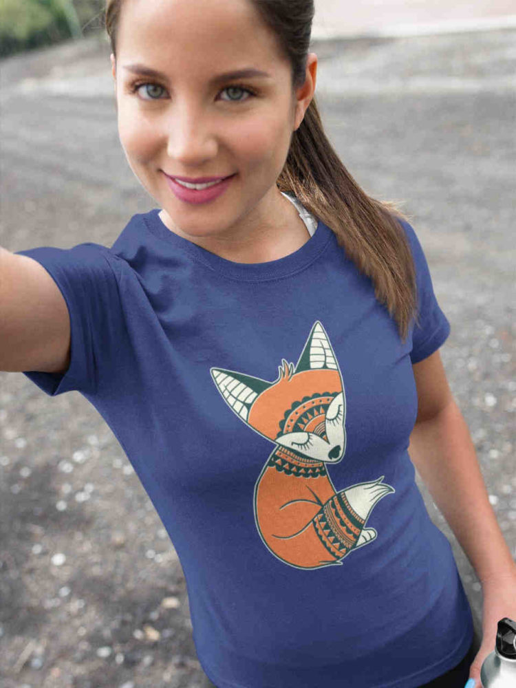 smiling girl wearing Tribal Fox on deep blue tshirt