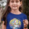 cute girl in deep blue tshirt with happy Unicorn running with bag