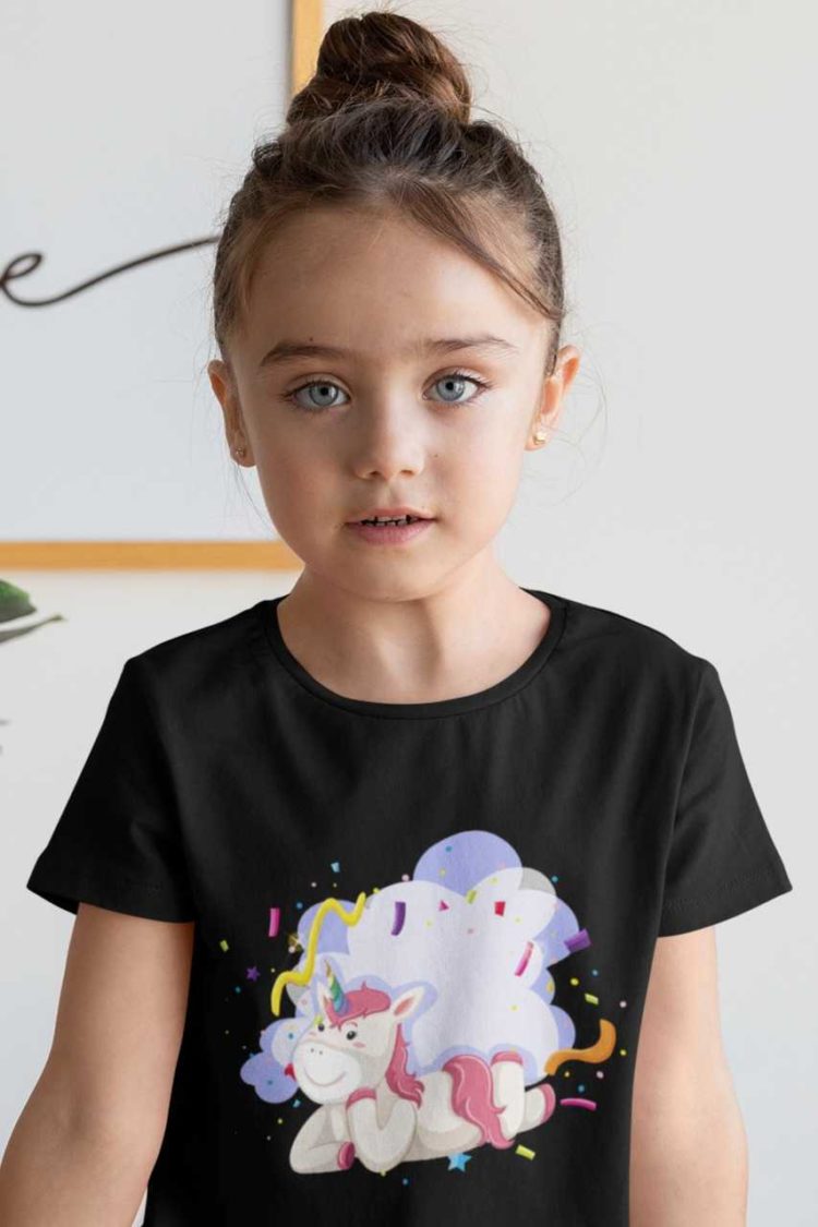 cute girl in black tshirt with Unicorn with party streamers