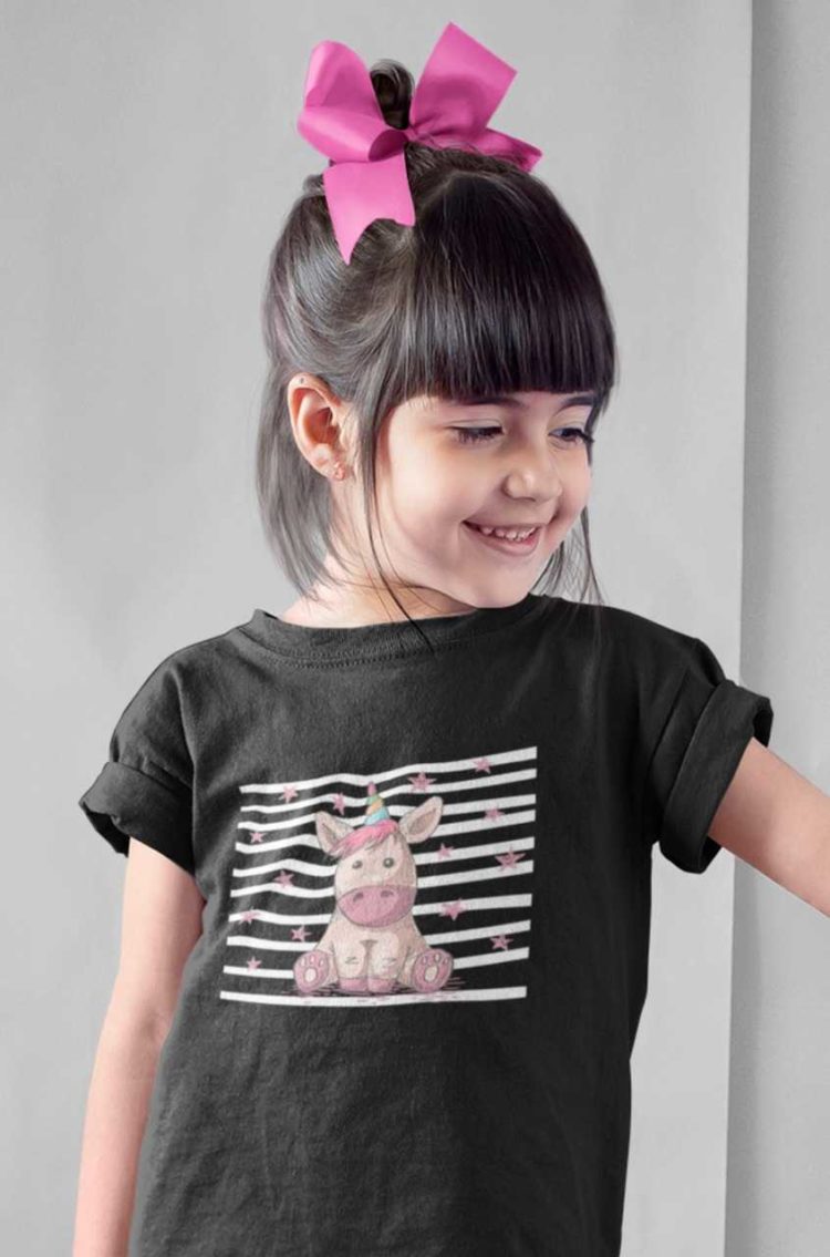cute girl in black tshirt with Unicorn sitting with stars