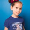 sweet girl in deep blue tshirt with Unicorn sitting with stars