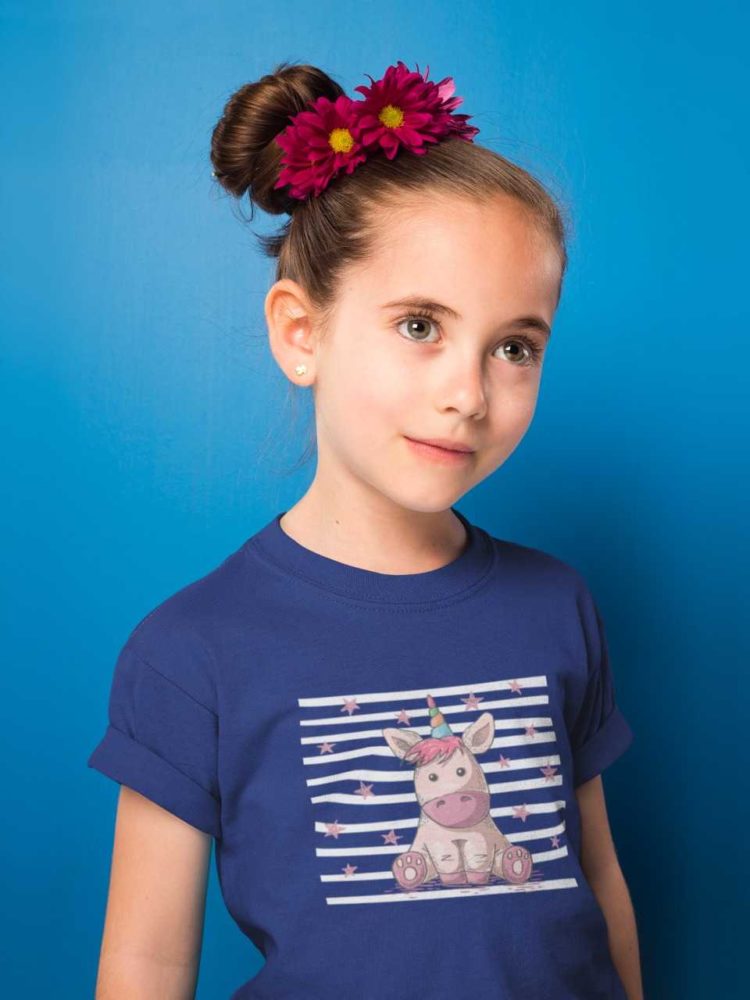 sweet girl in deep blue tshirt with Unicorn sitting with stars