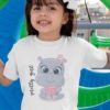 smiling girl in white tshirt with Baby hippo eating watermelon