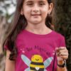 lovely girl in a dark pink Bee Magical tshirt
