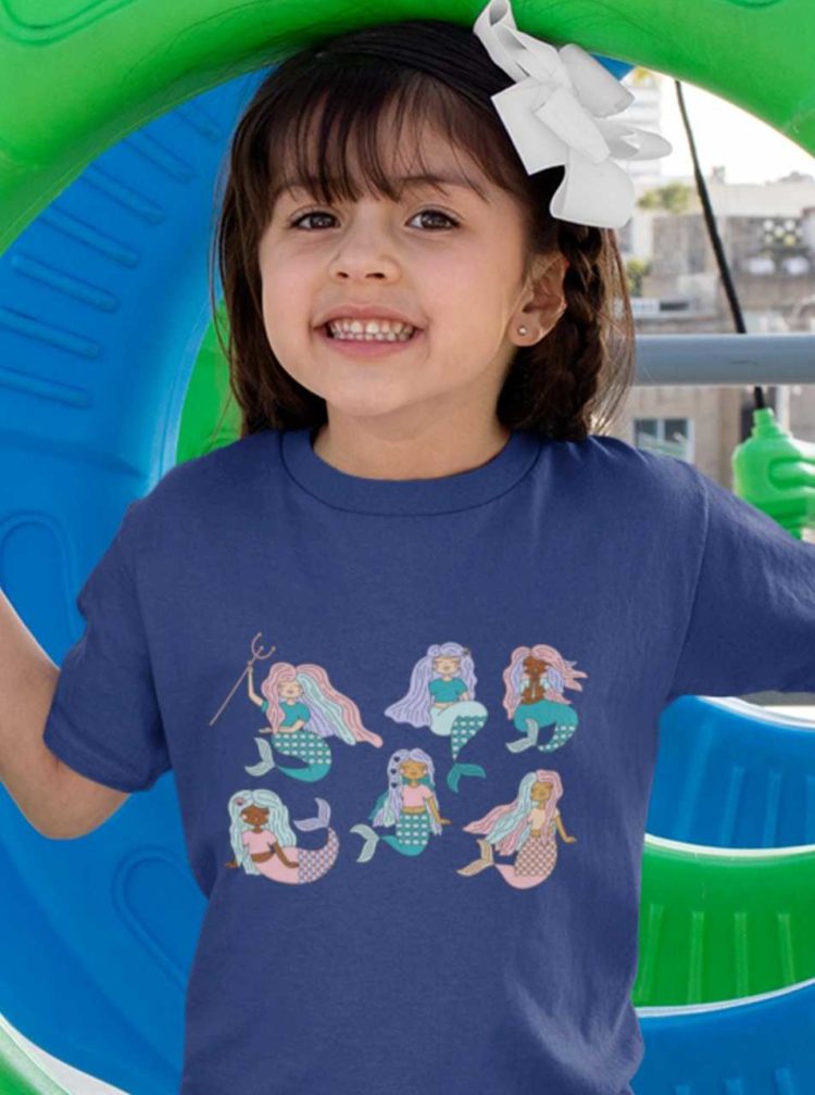 cute girl in a deep blue tshirt with Six mermaids swimming