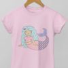 light pink tshirt with a Mermaid with blue hair