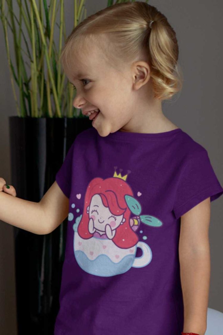 cute girl in a purple tshirt with a mermaid in a teacup