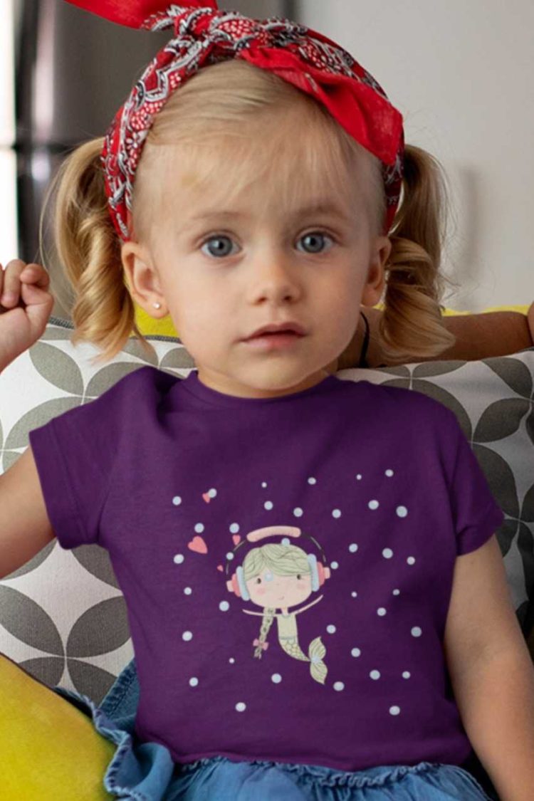 cute girl in a purple tshirt with a little mermaid wearing headphones