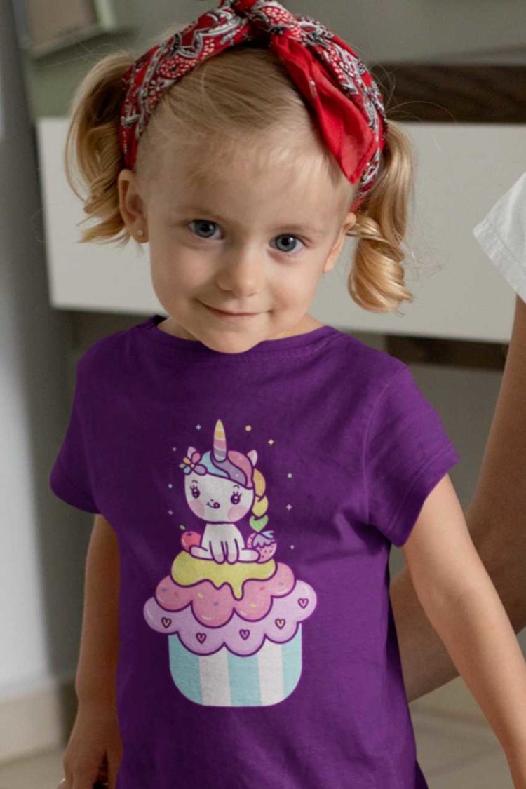 pretty girl in a purple tshirt with a Unicorn on a cupcake