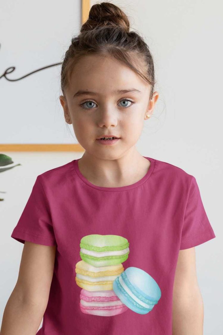 sweet girl in a dark pink tshirt with a Stack of Macarons