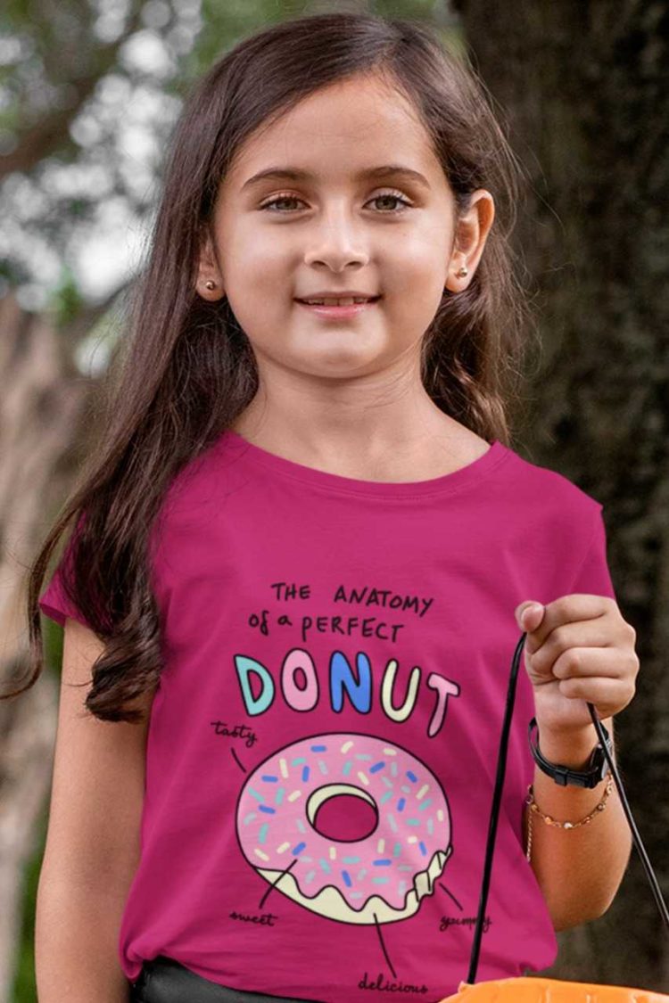 Cute girl in a dark pink tshirt with Anatomy of a perfect donut