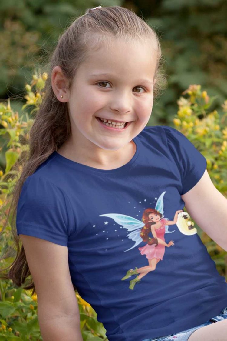 happy little girl in a deep blue tshirt with a fairy holding a lantern
