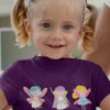 happy little girl in a purple tshirt with Three little fairies