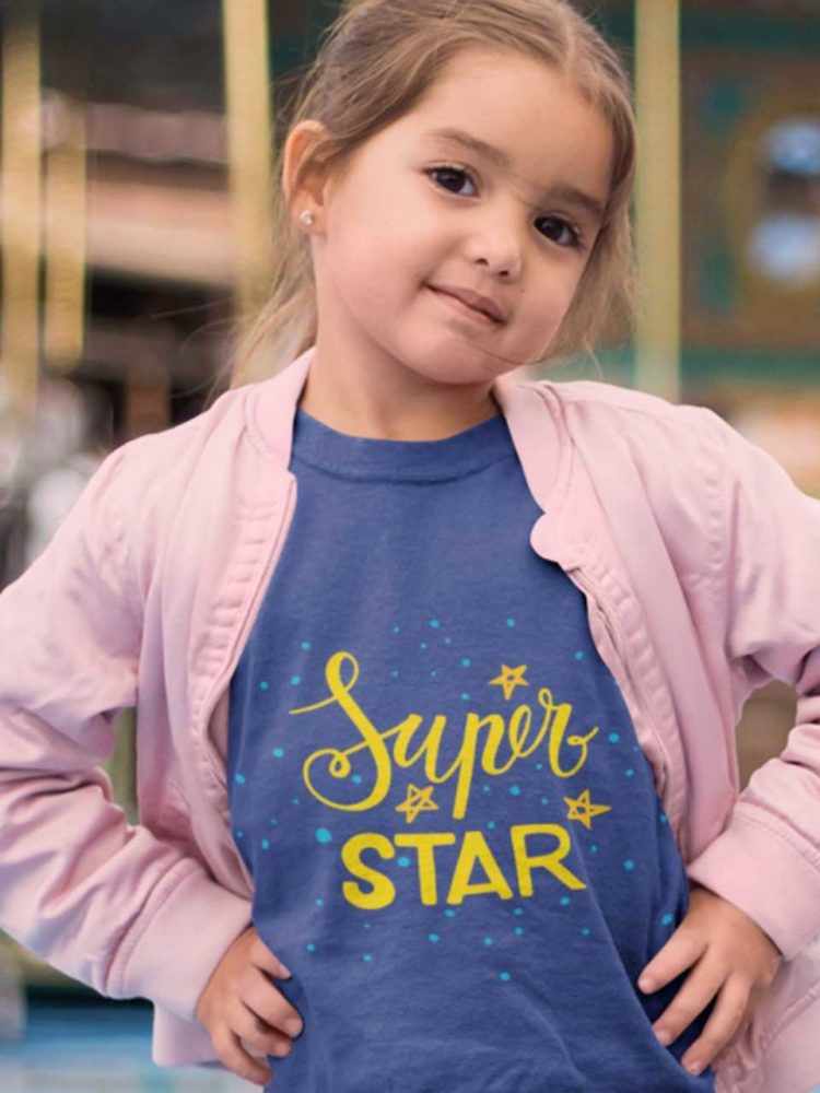 little girl in a deep blue Super Star tshirt