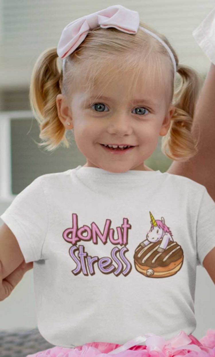 Little girll in a white Donut Stress Tshirt