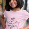 Cute girl smiling in a Light Pink Do More of What Makes You Happy Tshirt