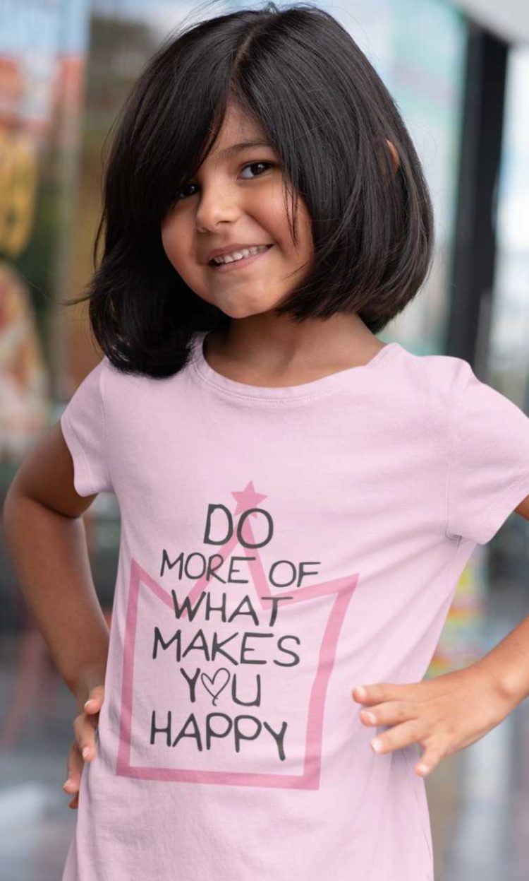Cute girl smiling in a Light Pink Do More of What Makes You Happy Tshirt