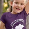 lovely little girl in a purple Live in Sunshine Tshirt