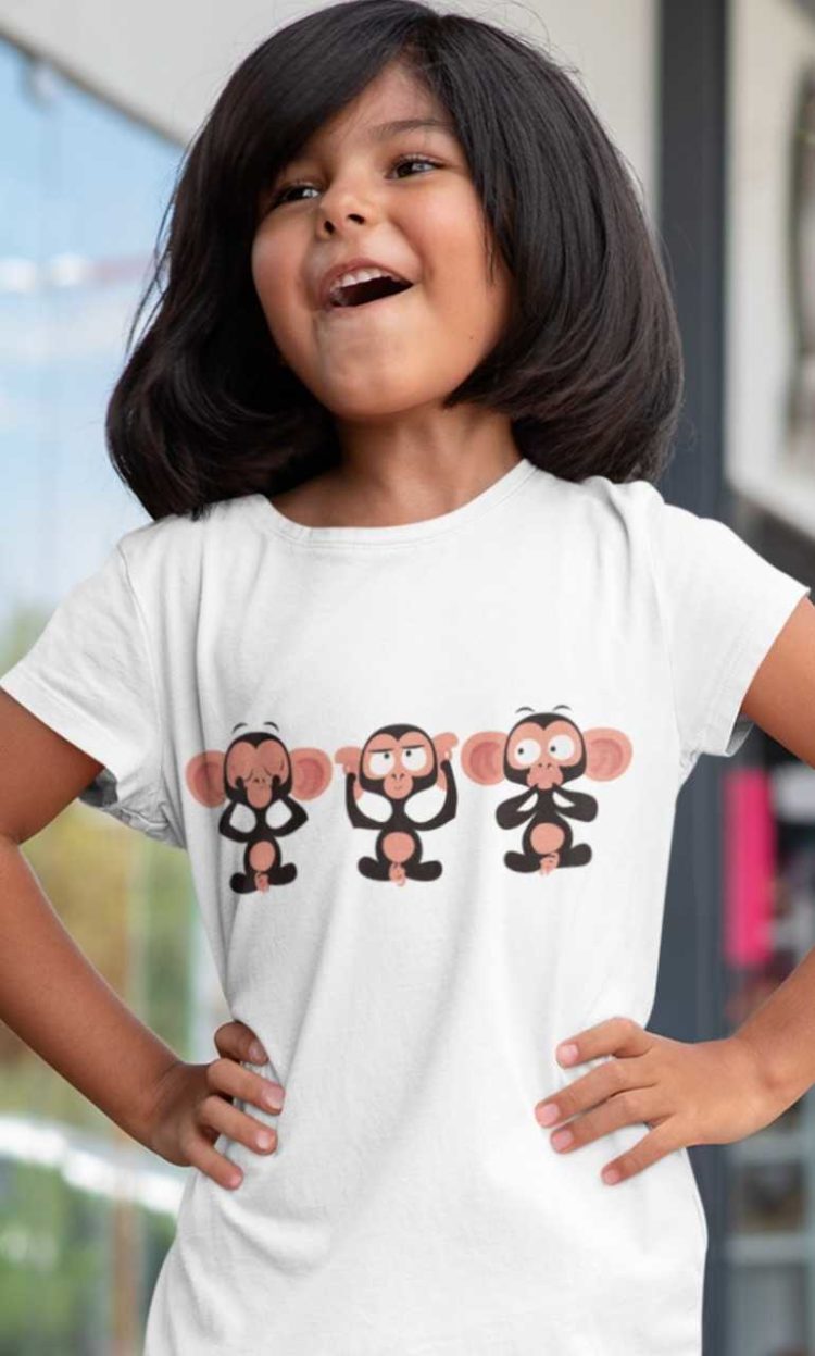 happy little girl in a white tshirt with Three Wise Monkeys