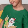 cute boy in a green tshirt with a Cat riding a Reindeer