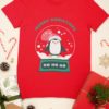 Red tshirt with a penguin inside a snow globe