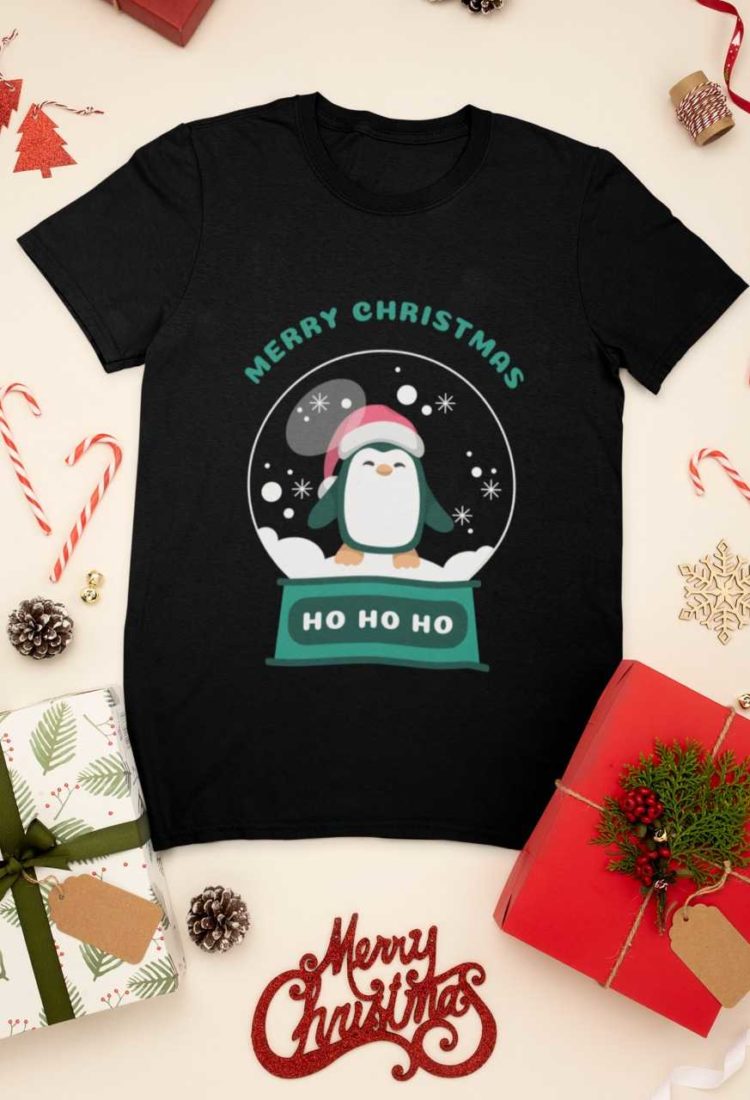 black tshirt with a penguin inside a snow globe