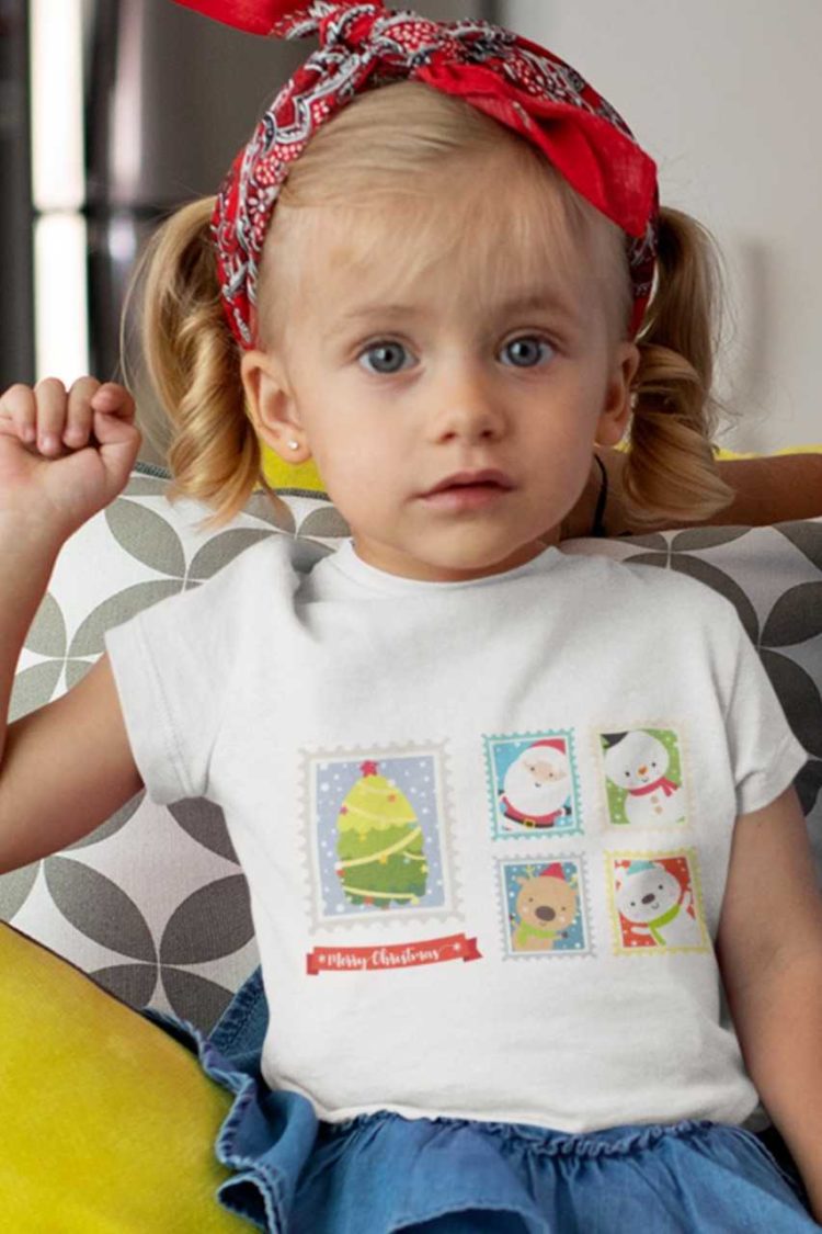 sweet girl in a white tshirt with Santa , reindeer, snowman on postage stamps