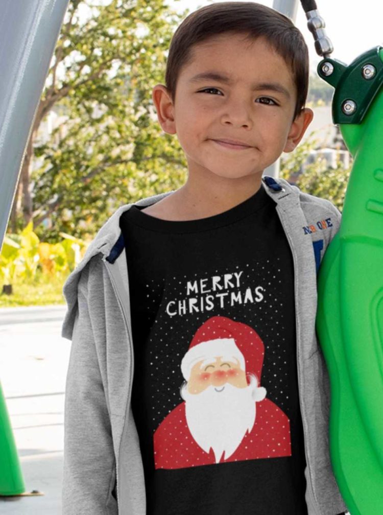 Sweet boy in a black tshirt with Santa and a Merry Christmas background