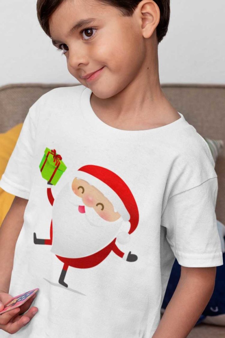 sweet boy in a white tshirt with Santa holding a gift