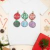 white tshirt with Christmas ornaments