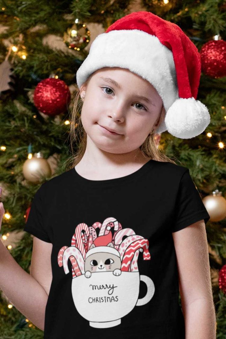 lovely girl in a black tshirt with Cats in a mug with candy canes