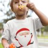 cute boy in a white tshirt with a Happy Jumping Santa