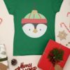 Green tshirt with penguin christmas ornament