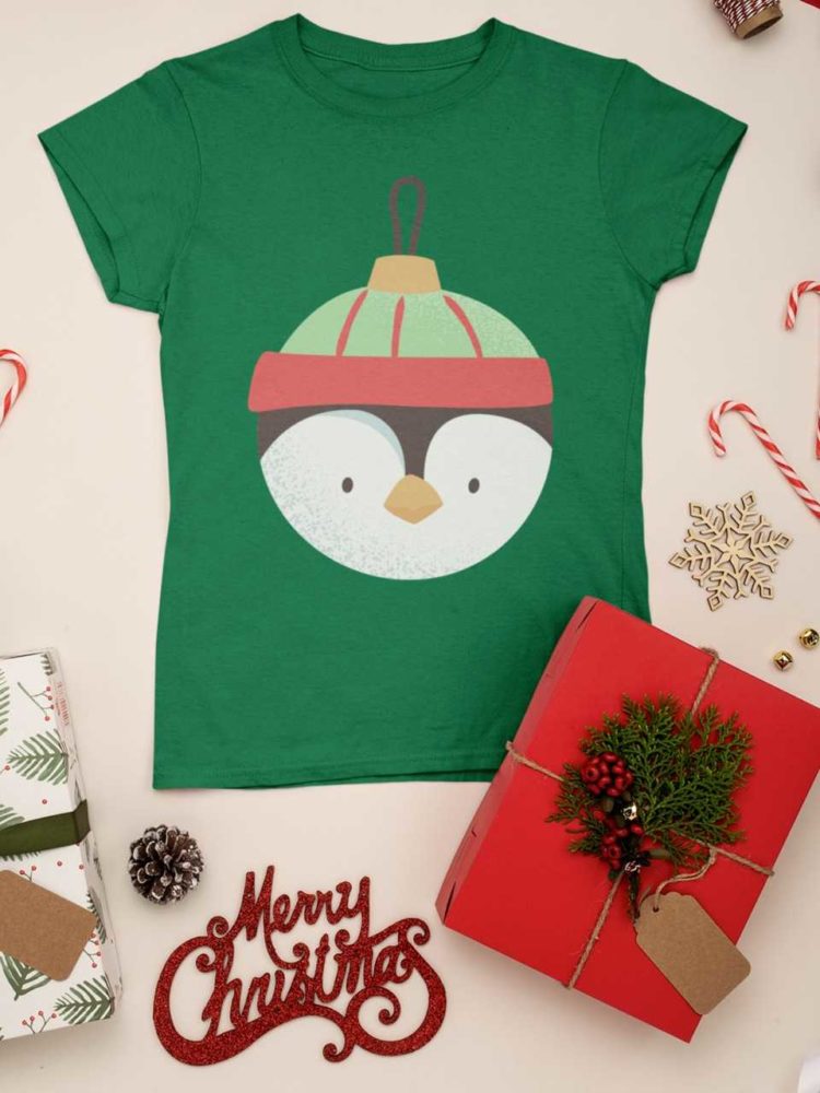 Green tshirt with penguin christmas ornament