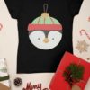 black tshirt with penguin christmas ornament