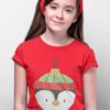 lovely girl in red tshirt with penguin christmas ornament