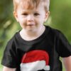 cute boy in a black tshirt with Santa Hat