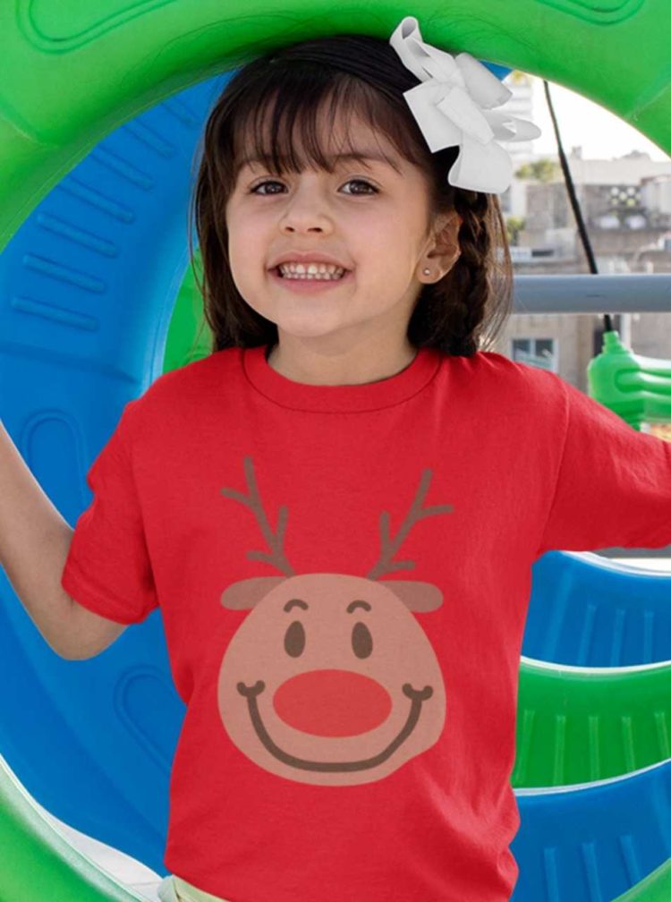 sweet girl in a red tshirt with a Smiling reindeer face